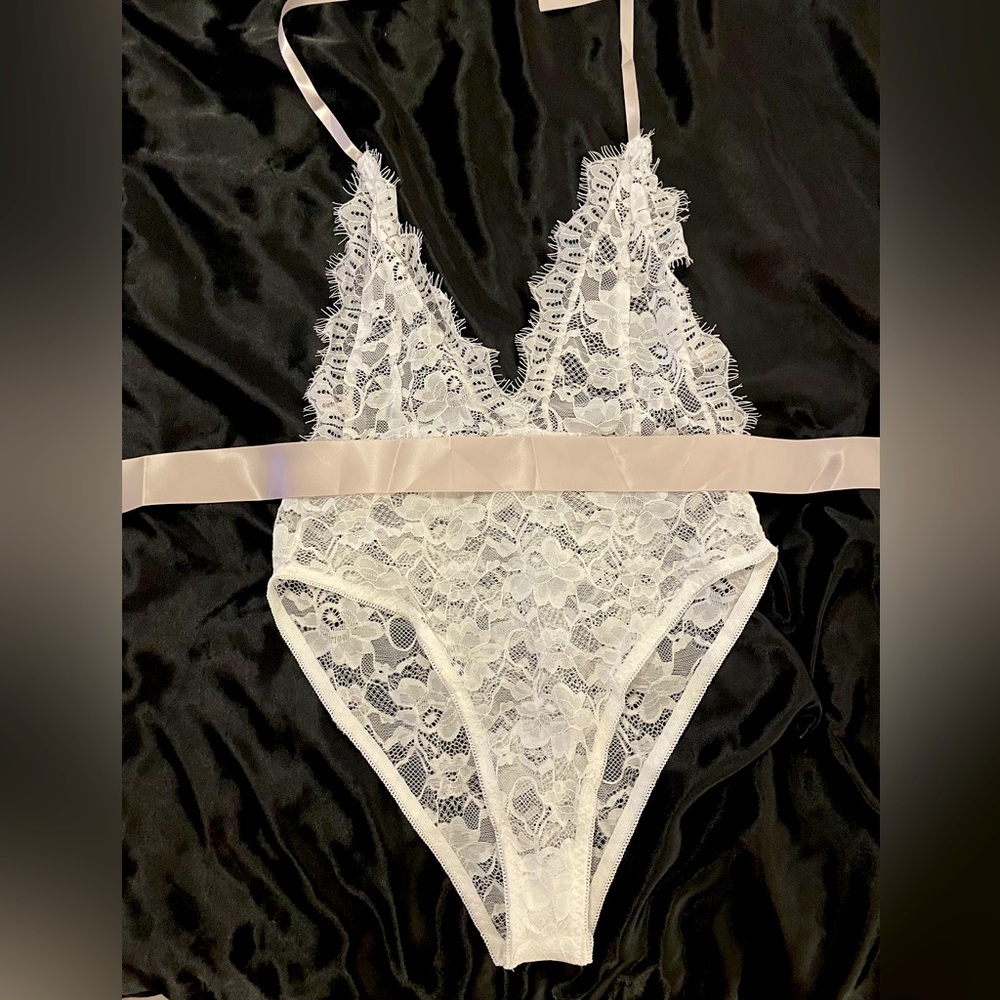 White one piece lingerie with lavender sash